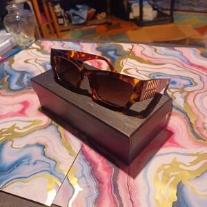 Miu Miu Tortoise Shell Sunglasses